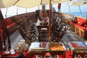 table set for a luxury dining experience on the red baron samui sailing yacht