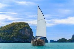 naga sailing yacht at full sail near ang thong national marine park