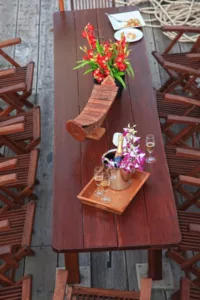 champagne on the lounge table of red baron samui sailing junk