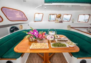 image showing dining table with thai buffet lunch on a family friendly slider catamaran charter koh samui thailand