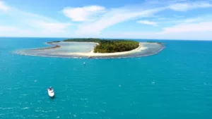 image showing our luxury motor yacht near a deserted island in the gulf of thailand