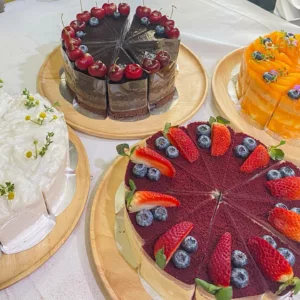 cheese cakes selection of choices with cherries and strawberries