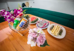 image showing food and drinks on a family friendly slider catamaran charter koh samui thailand