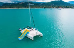 image showing slide and watersports equipment on a family friendly slider catamaran charter koh samui thailand